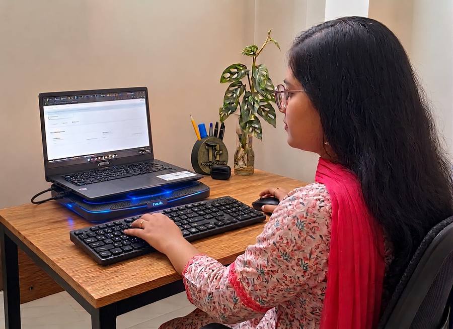 Web Topaz team member working from her desk